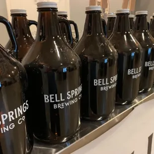 a row of beer jugs