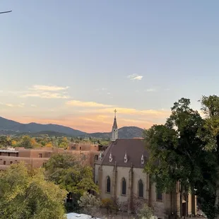 a view of a church and a parking lot