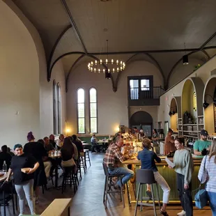 people sitting at tables and eating