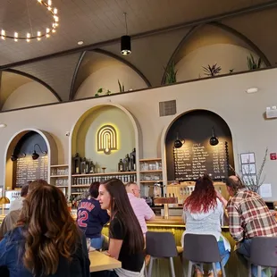 a group of people sitting at tables