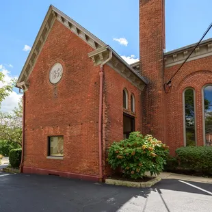 a brick building with a bell tower