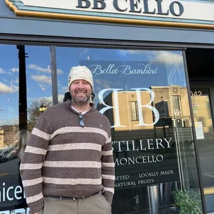 a man standing in front of a business