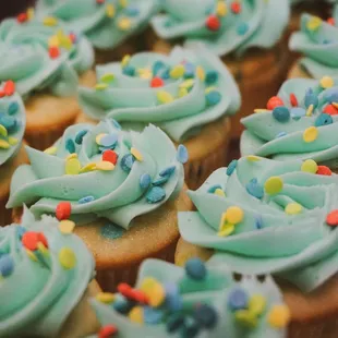 cupcakes with blue frosting and sprinkles