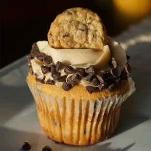 a cupcake with a cookie on top