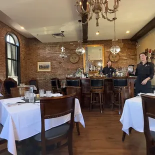 a woman standing in a restaurant