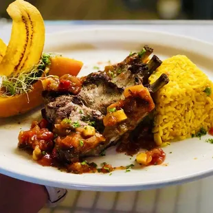 Chefs Special - grilled Baby back Ribs in a Apricot and Mango Salsa served with Yellow rice and Vegetables