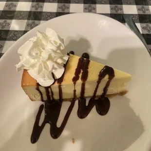 Cheesecake with chocolate syrup.