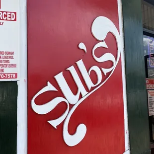 a red and white sign