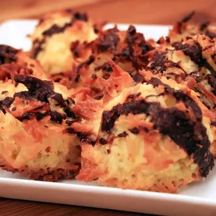 Classic coconut macaroon with finely grated orange zest and drizzled with chocolate.