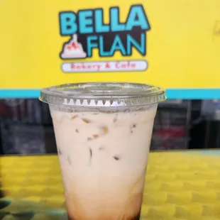 Creamy, sweet, and refreshing iced Cuban latte made with a Bustelo Cuban Espresso at Bella Flan!