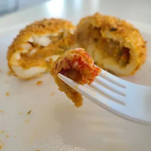 Mashed Potato Ball Filled with Spicy Crawfish Etoufee, Coated in Crispy Panko and Deep Fried   A Bella Flan Original!