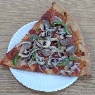 This turned out to be my dinner.  This slice of "deluxe" pizza was, for the most part, fine.