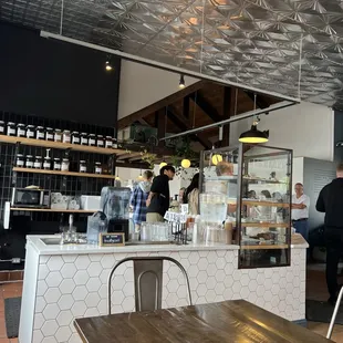 Inside (but not a great photo). Seating on the other side of counter as well. Way cuter in person!