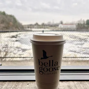 a cup of coffee on the window sill