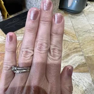Gel manicure, glitter all over my fingers, nails way too short and look terrible. We were charged 45 for just this manicure.