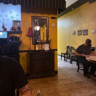 a man sitting at a table in a restaurant