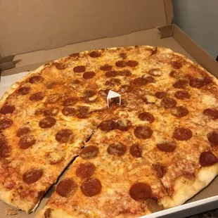 a pepperoni pizza in a box