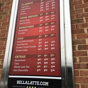 a menu on a brick wall
