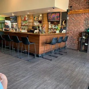a woman sitting at a bar