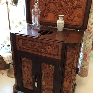 Beautiful carved bar cabinet!