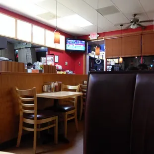 A cute warm restaurant have one group party seat