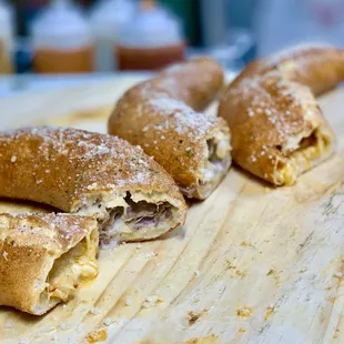 Half moon roll, stuffed with cheese and chicken or steak