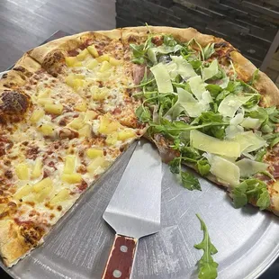 Large pizza- half pineapple, half prosciutto  and arugula. Yum.