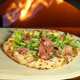 a pizza being cooked in an oven