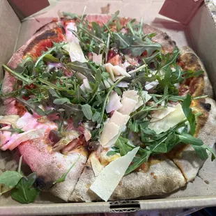 My pizza! Ready in 6 minutes! Arugula with Parmesan, calamata olives and artichoke hearts! Don't worry they have traditional topping too!