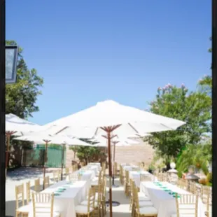 with our Market umbrellas create that high end outdoor venue look combined with our gold or silver Chivari chairs.