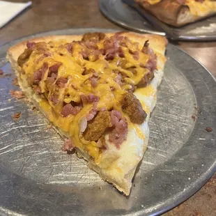 Weekend breakfast meat pizza slice