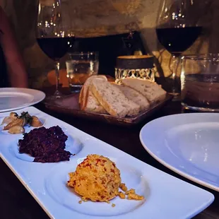 a plate of food and wine glasses