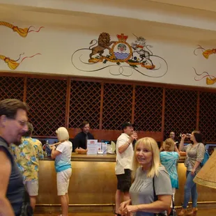 a woman standing in front of a counter