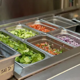 Our salad bar is now open! Customize your sandwich, or get a healthful salad with our washed after each use tongs!