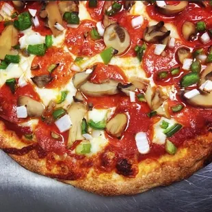 a closeup of a pizza with mushrooms and cheese