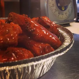 a bowl of hot dogs with sauce