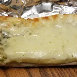 a cheesy bread with melted cheese