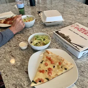 a man eating a slice of pizza