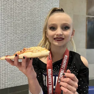 Our cheer Champion gets a pizza