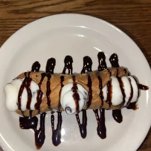 Cannoli with chocolate syrup