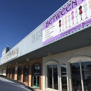 It is next to a consignment store.