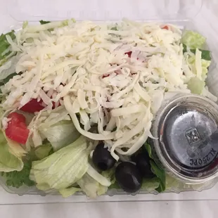 House salad (small) - Very good size Iceberg lettuce, tomatoes, olive and shredded mozzarella cheese