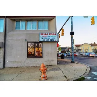 a fire hydrant in front of a restaurant