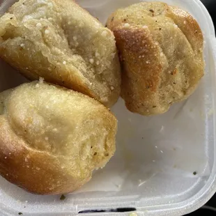 Three of the four garlic knots we got. Crispy, hot, and delicious!
