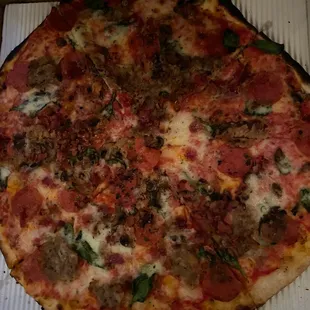 Medium size with toppings sausage, bacon, pepperoni, oregano, on thin crust