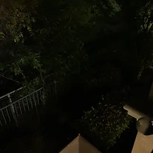 No lighting for creek side apartments- this is where someone used ladder to get to my second story patio to steal our bike!