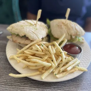a sandwich and french fries on a plate