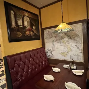 a booth with a map on the wall