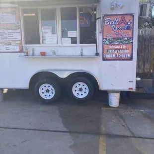 Food truck in gas station parking lot-