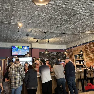 a large group of people at a bar